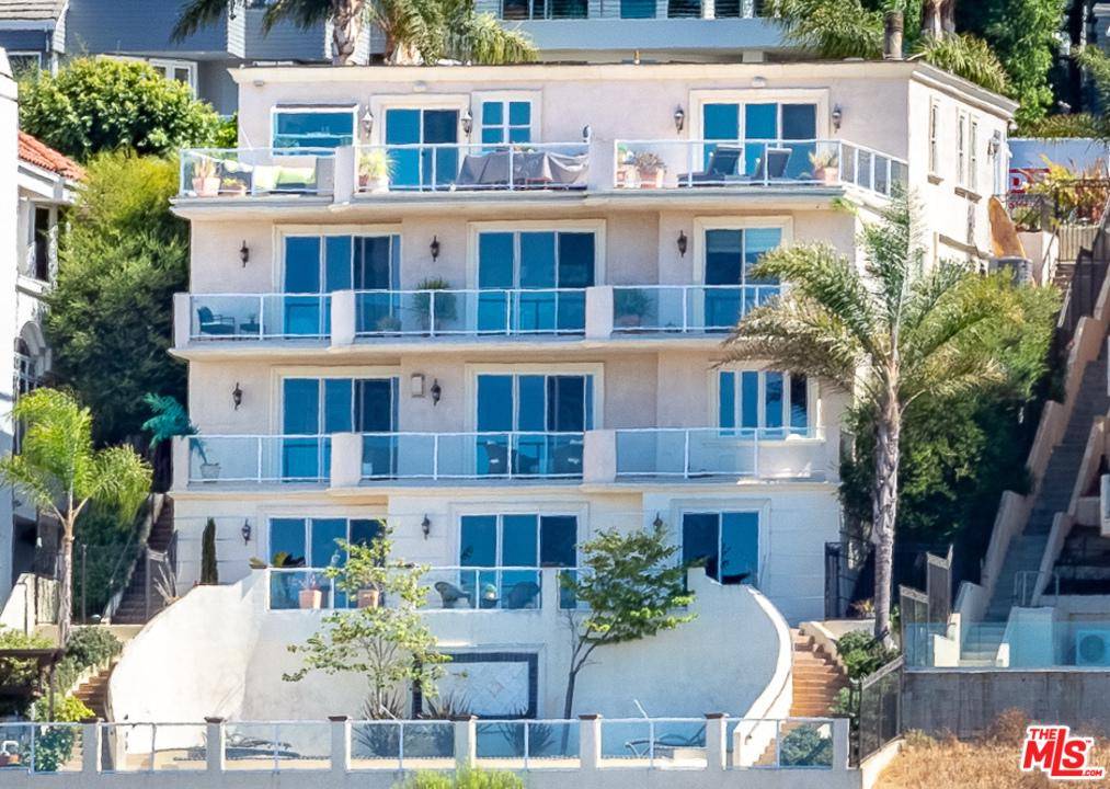 Perched along the bluffs of Playa del Rey sits this masterful Silicon Beach modern-Mediterranean w/ panoramic ocean