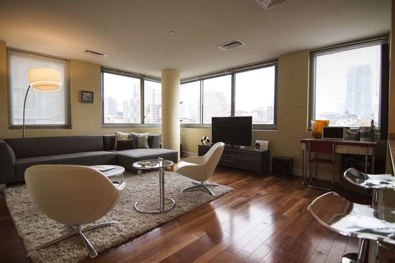 Welcome yourself to this finely crafted Northeast corner unit with beautiful skyline views