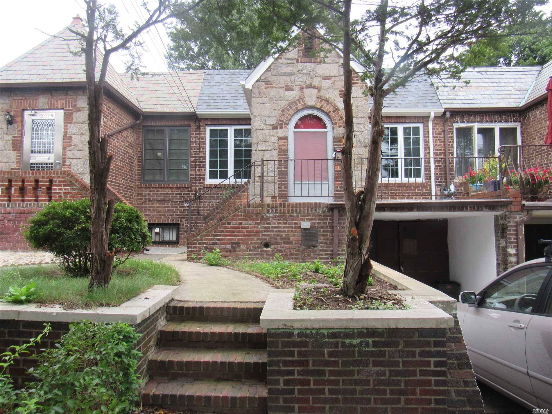 Brick 2 Bedroom High Ranch With Street Level Basement.