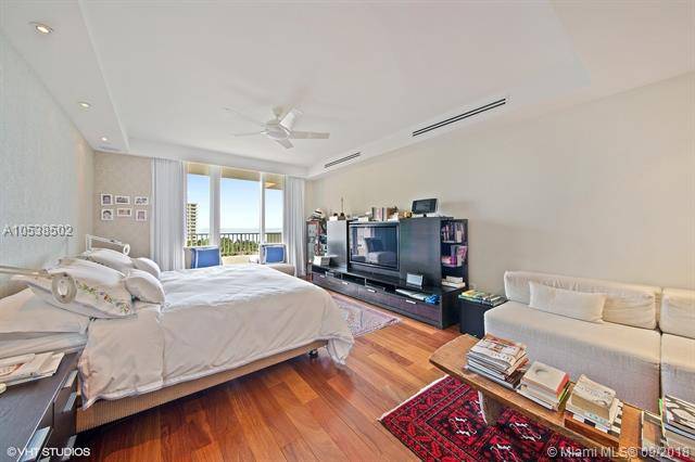 SPACIOUS 3/3 PLUS DEN HAS STUNNING BAY AND OCEAN VIEWS FROM THIS FLOW THROUGH LAYOUT