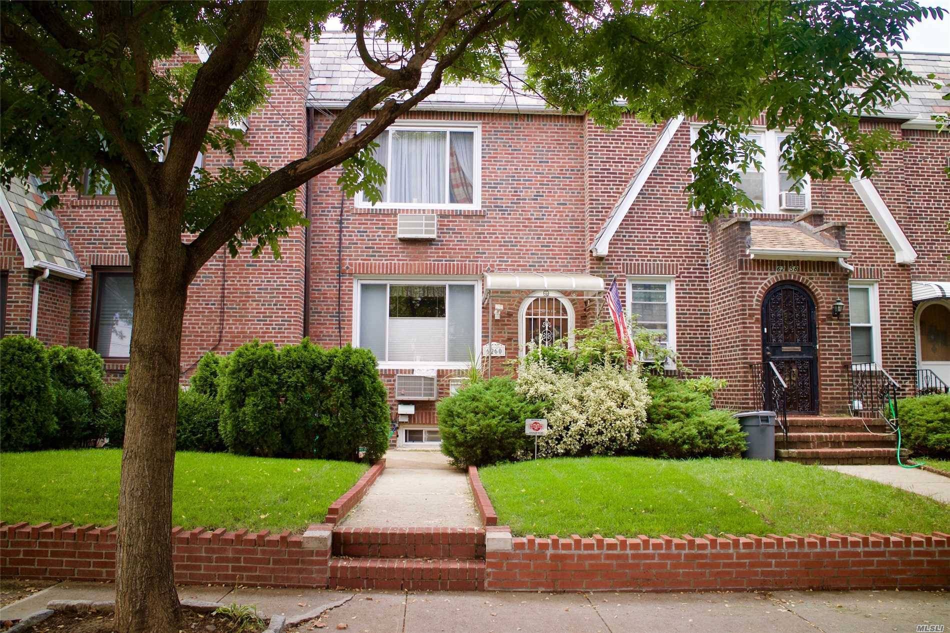 Exquisitely Kept Tudor In Middle Village North Situated On A Tree Lined Street.