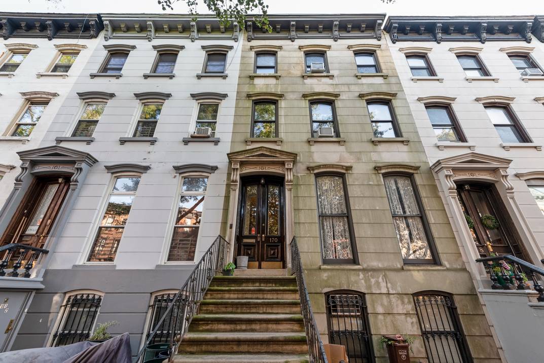 Fantastic 20-foot-wide Italianate limestone townhouse in the heart of Park Slope.