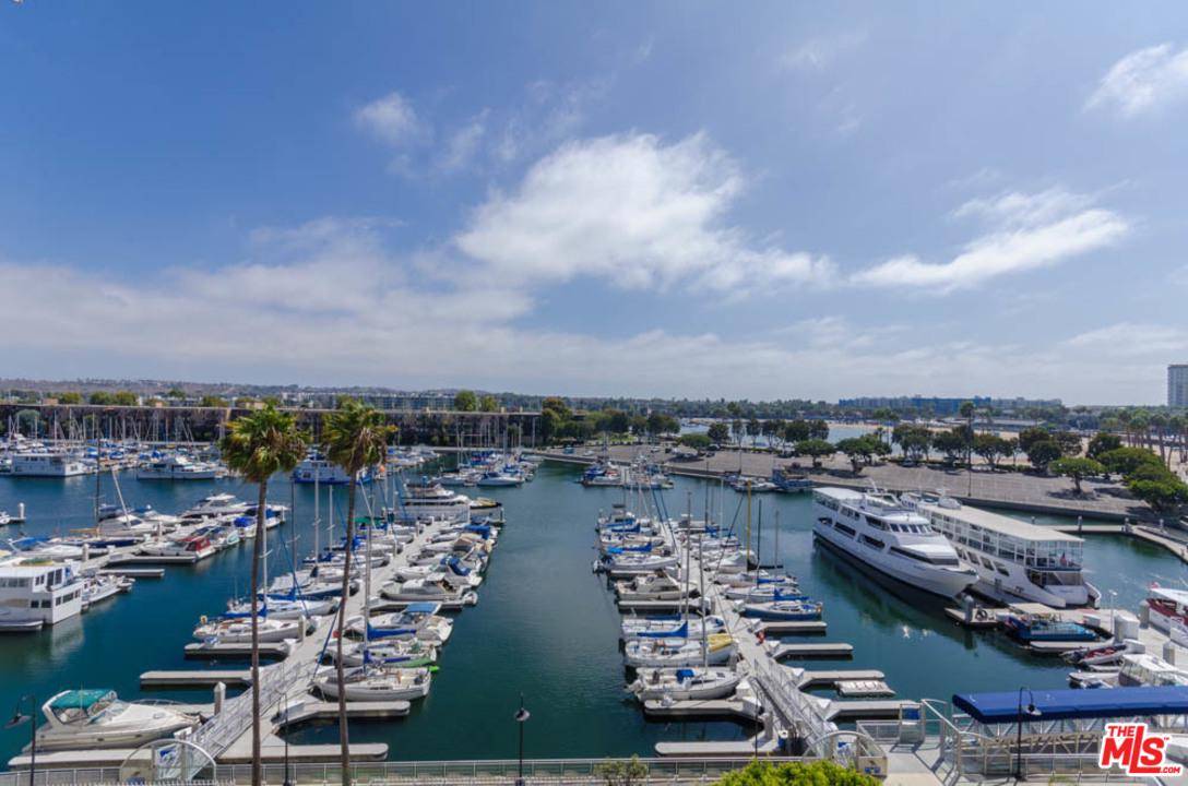 Extraordinary Marina and Harbor views from this lovely renovated one bedroom and one bath home that exudes warmth and charm