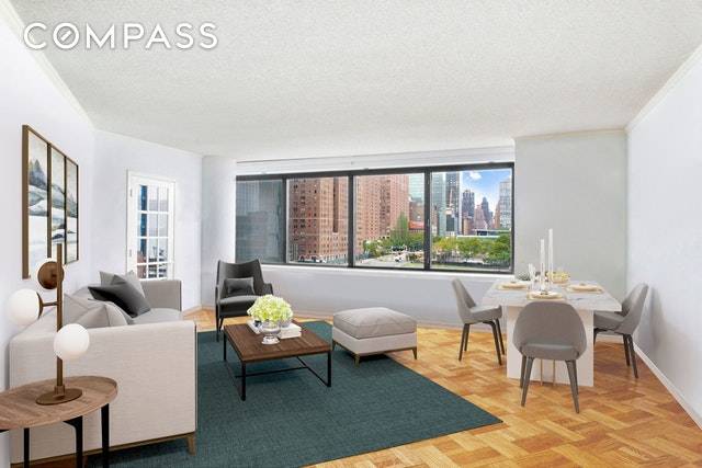 Spacious 2 bedroom, 2 full bath home with wall to wall windows overlooking the East River facing the historic Pepsi Cola sign.