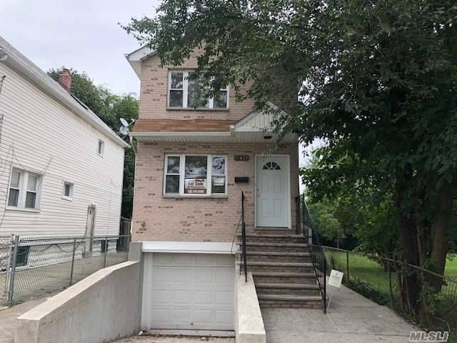 Quiet Mid Block Location, Renovated Property With New Kitchen, Hardwood Floors, Large Full Height Basement With Separate Outside Entrance.