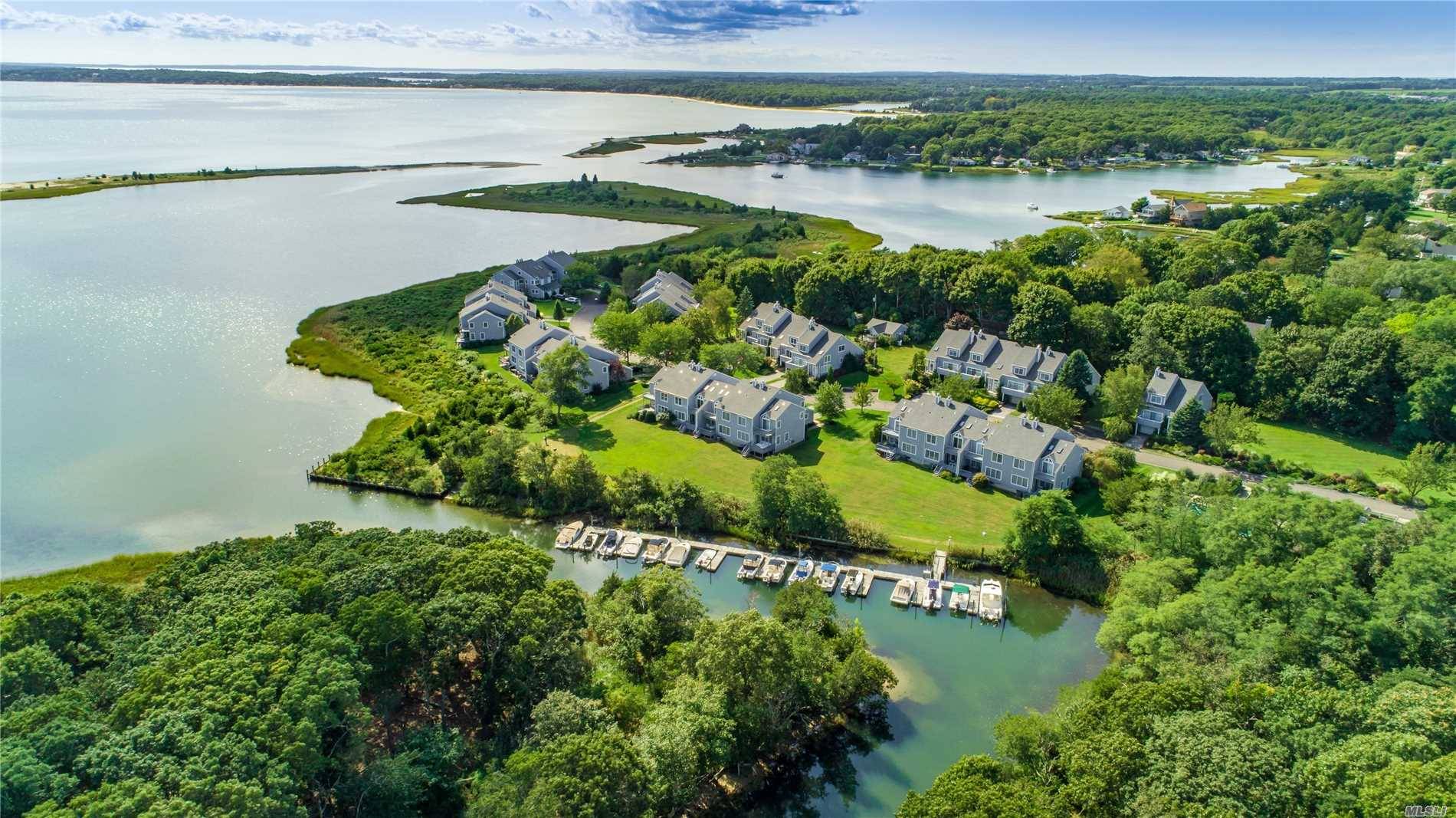Enjoy Creek And Bay Views From This End Unit Waterfront Condo In The Cove At Southold.