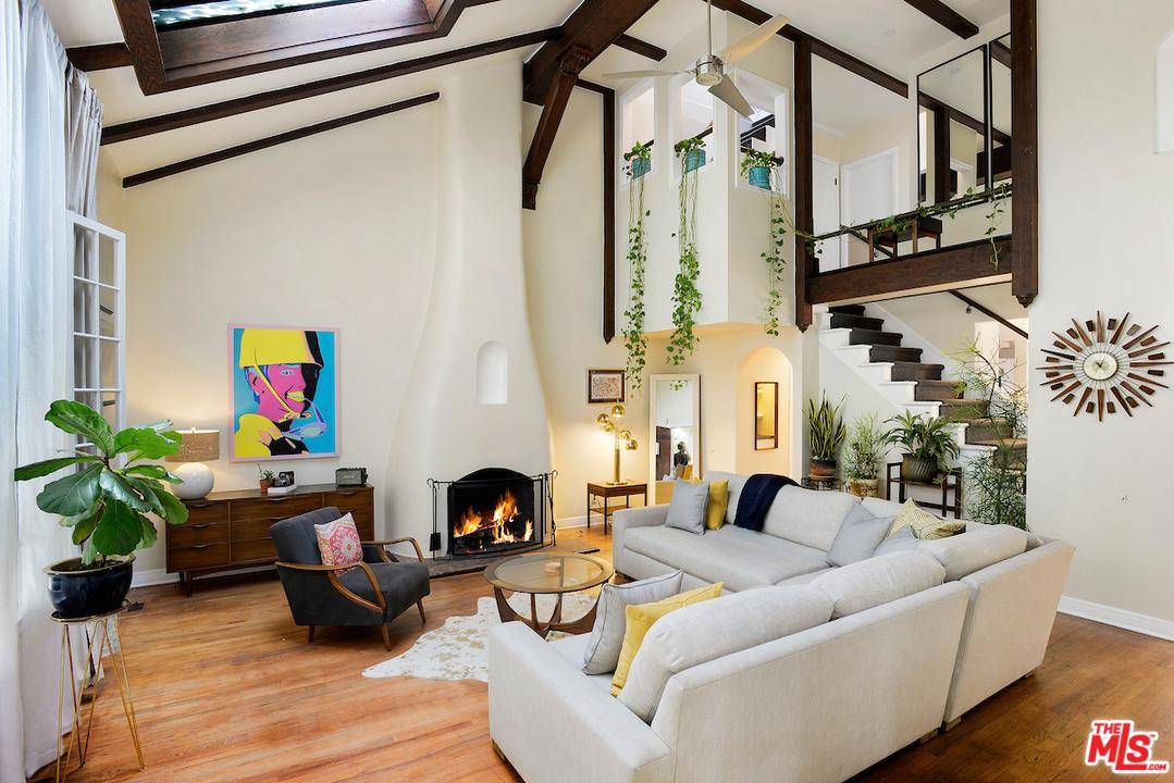 Original Spanish architecture and charm abound this one of a kind townhome