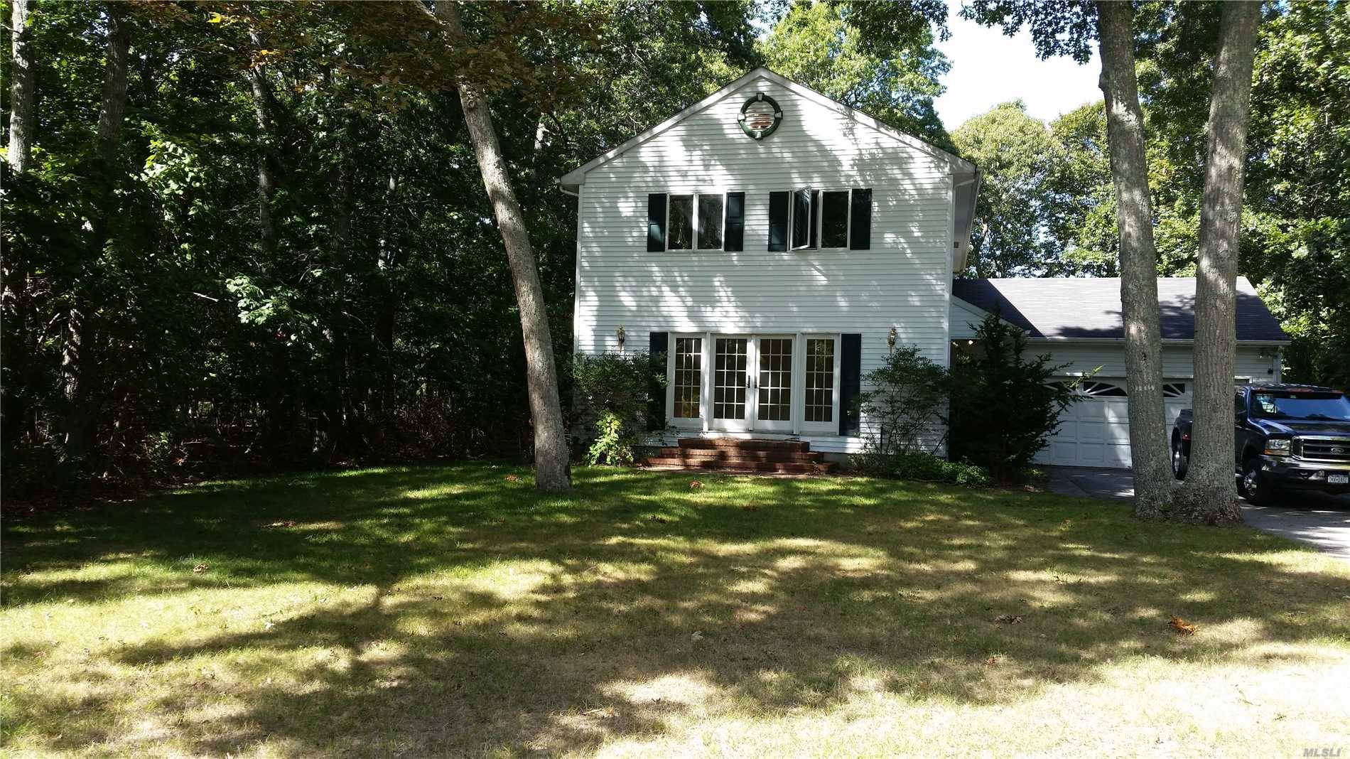 Enjoy Your Summers Or Live Year Round In This Bright, Airy 2 Story Home On A Wooded 1/2 Acre Lot In A Highly Desirable East Marion Community.