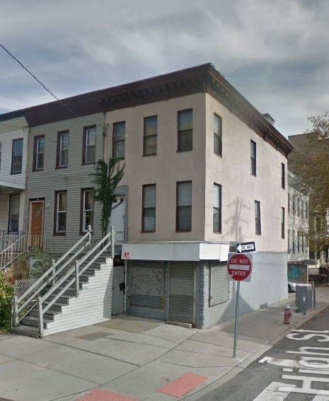 Existing 3 story building containing 2 residential units and 1 commercial space