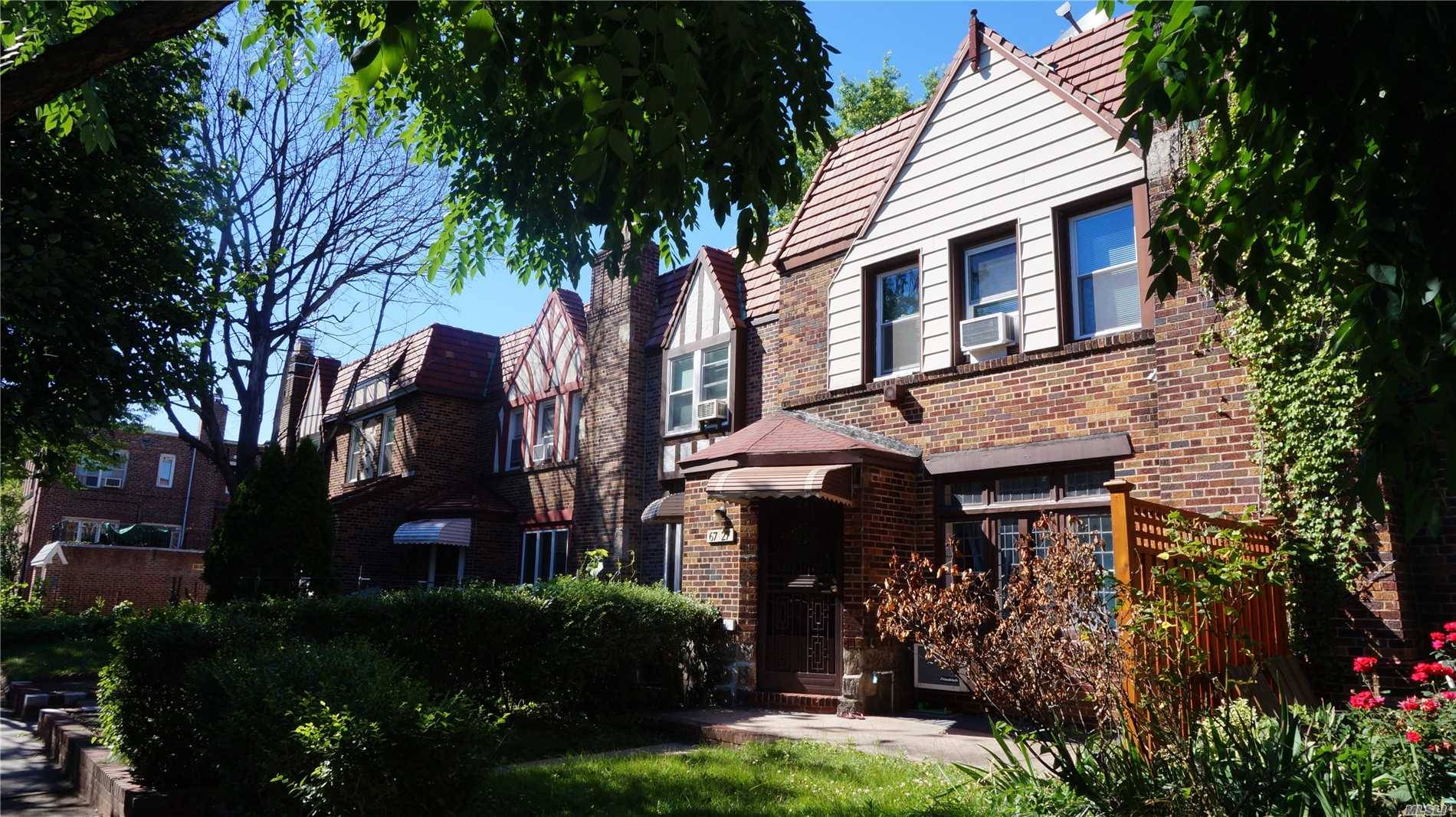 Tudor Style Town House Located On A Quiet, Beautifully Maintained Street.