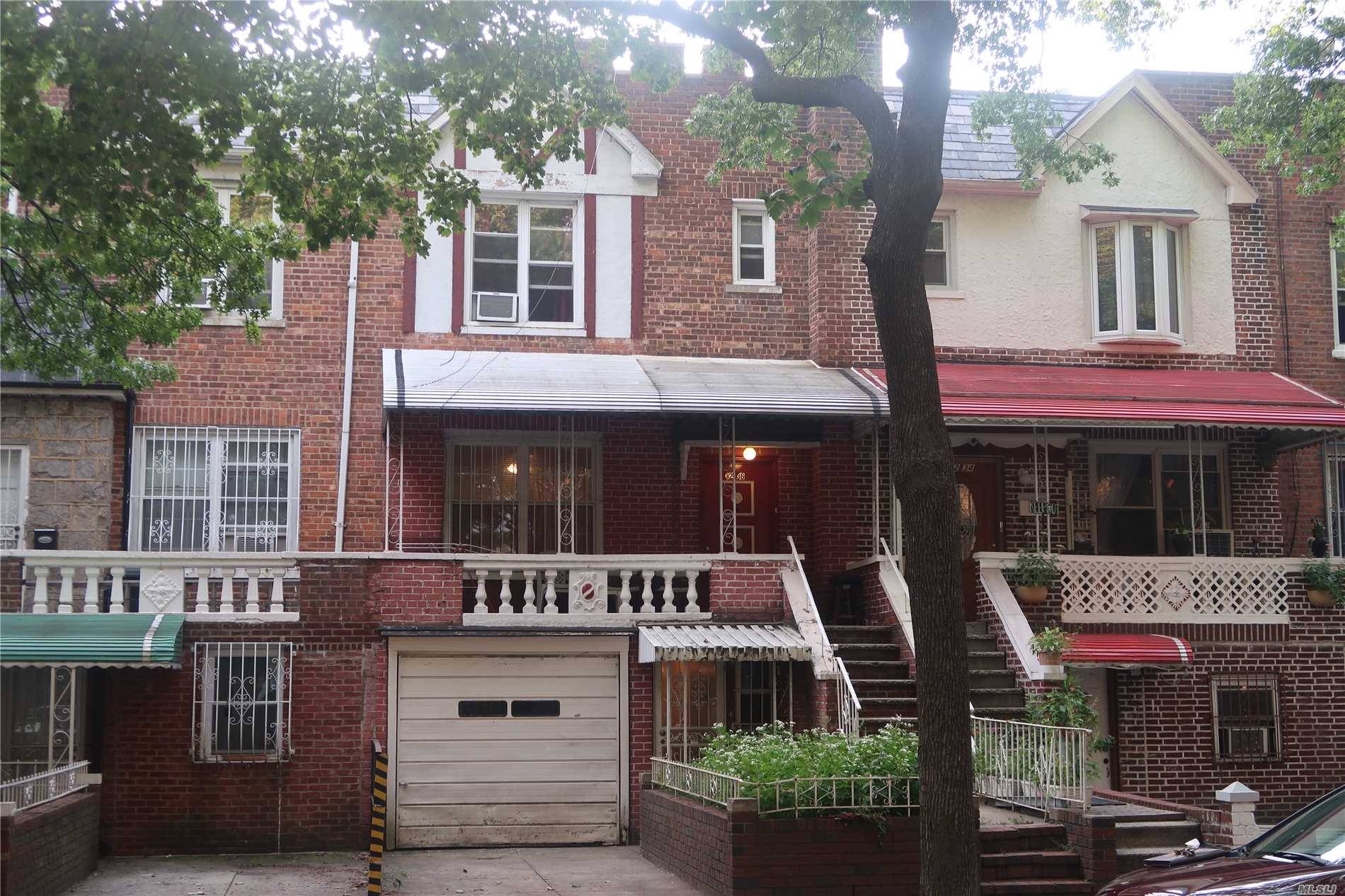 Jackson Heights/ East Elmhurst, Updated Brick Two Family Home.