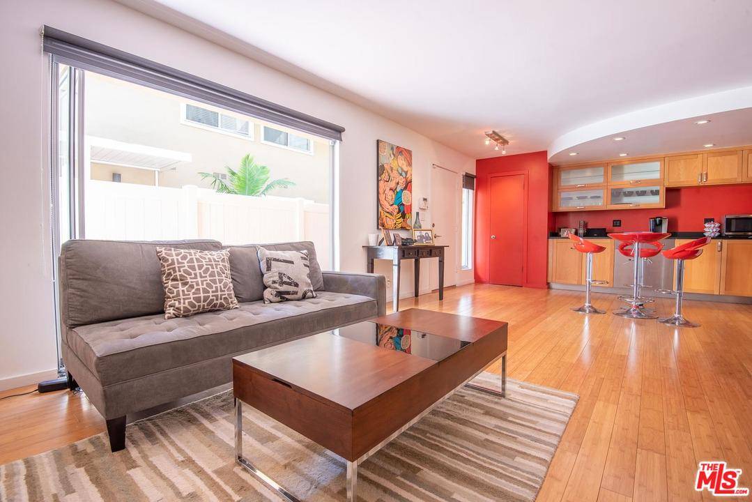 Modern updated unit in a wonderful mid-century courtyard building featuring a beautiful pool and spa in the heart of West Hollywood