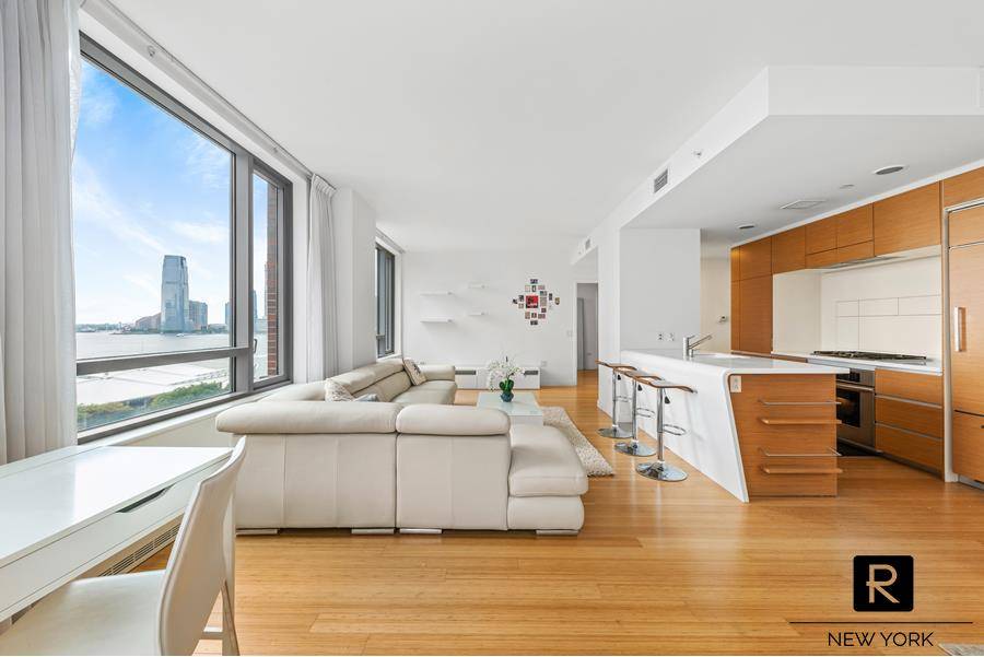 Exquisite two bedroom two bath apartment with river and marina views in the Riverhouse ; the only water front condominium in North Battery Park.