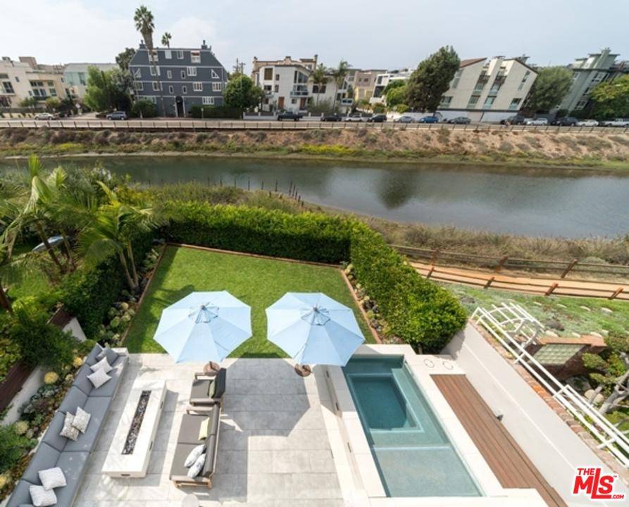 Updated Canal Front beach home on one of the largest lots and backyards in the Silver Strand