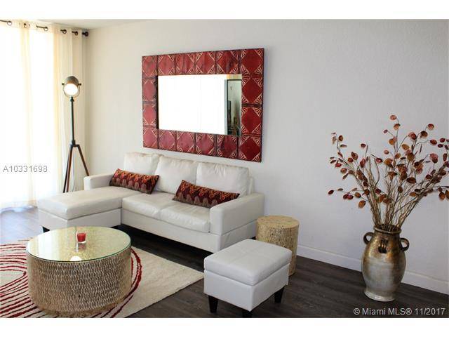 Fully furnished ground level unit with private Lanai Patio area and private pool access