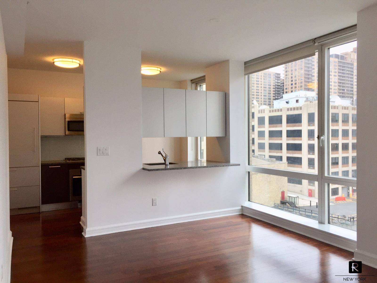 Spacious one bedroom apartment featuring generous closet space, floor to ceiling windows and hardwood floors throughout.