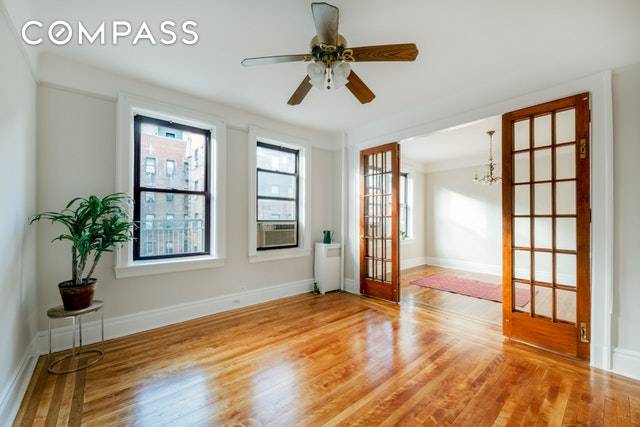 Location, light and space abounds in a fabulous, beautiful 5 room floor plan with 2 bedrooms, living room, dining room and an eat in kitchen in prewar historic Jackson Heights.