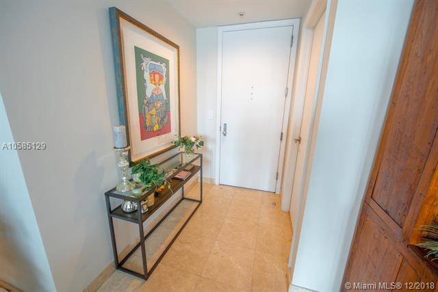 Live in Brickell Key and feel at home with this remodeled unit with two master bedrooms