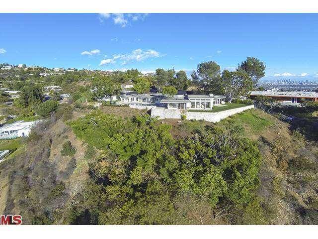 Stunning estate in prime Trousdale with spectacular city to ocean views located at the end of North Hillcrest Road