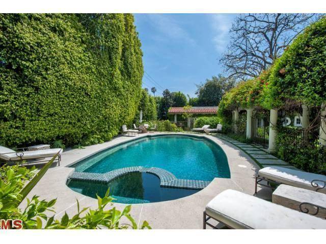 Behind iron gates sits this magnificent Mediterranean on one of the best streets in Beverly Hills