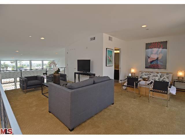 Stunning and spacious 2 story architectural penthouse located on a quiet tree-lined street in the heart of West Hollywood