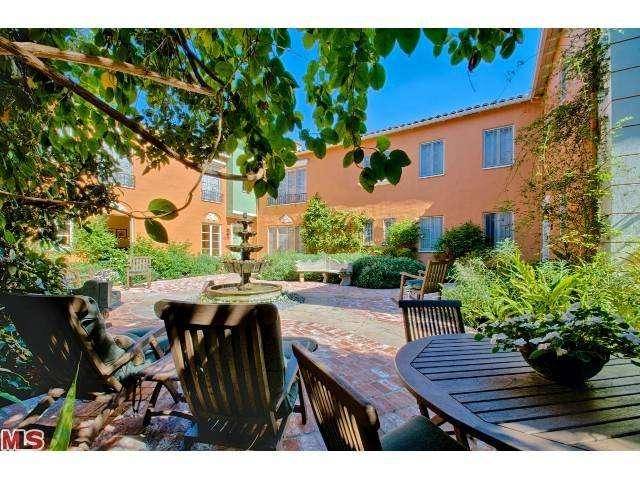 Magnificently restored and updated classic Mediterranean Courtyard property on double lot