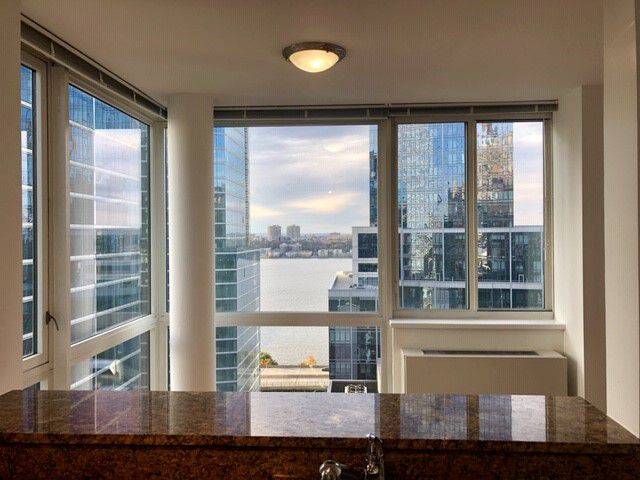 Breathtaking 2 Bedroom Oasis With Ceiling to Floor Window Views of NYC