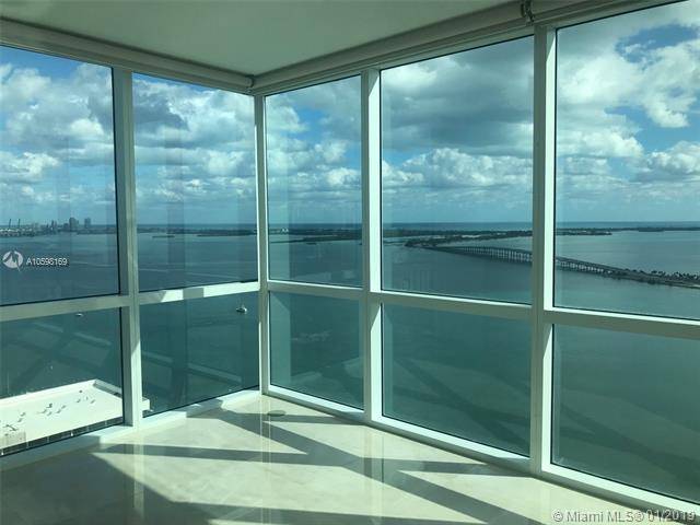 Breathtaking bay and ocean views from this 3 bed / 3 bath renovated corner unit