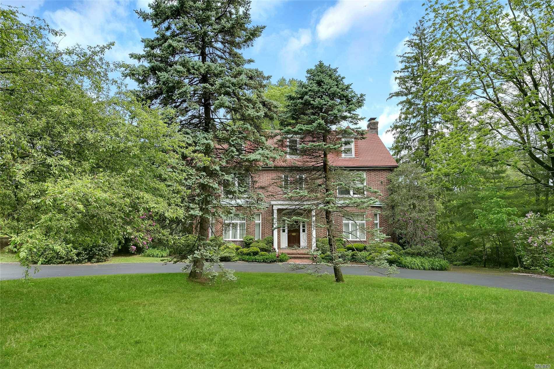 Lattingtown. Stately Brick Country Manor Set On Over 2 Private And Wondrous Acres In Lattingtown.
