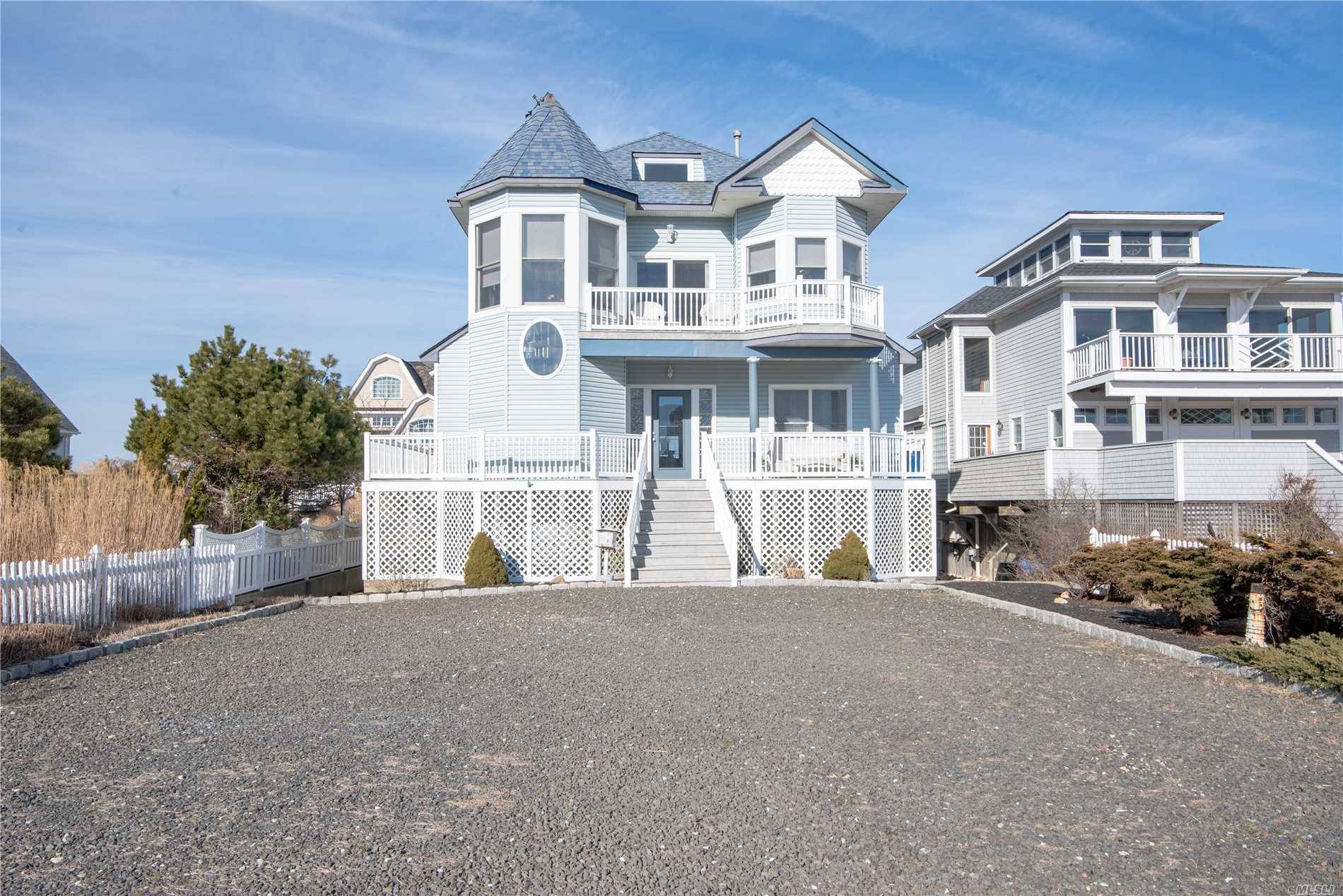 Gorgeous Multilevel Bayfront Dunes Home With Stunning Ocean & Bay Views.