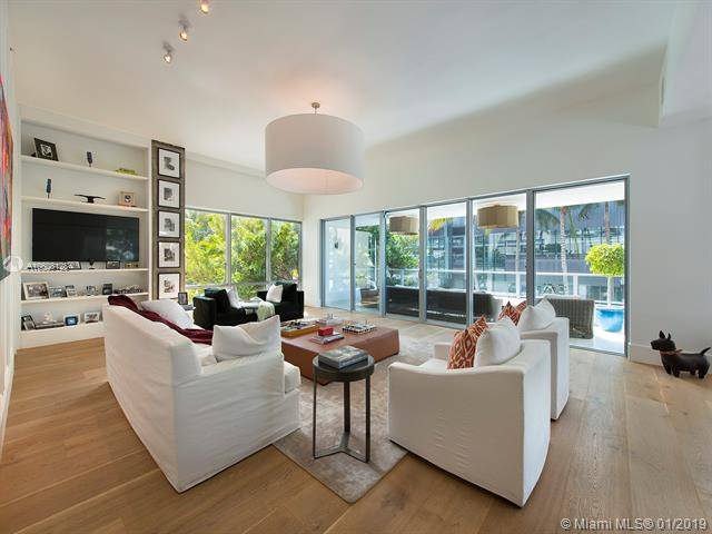 This completely renovated 3-story beach house is the embodiment of Miami Beach luxury