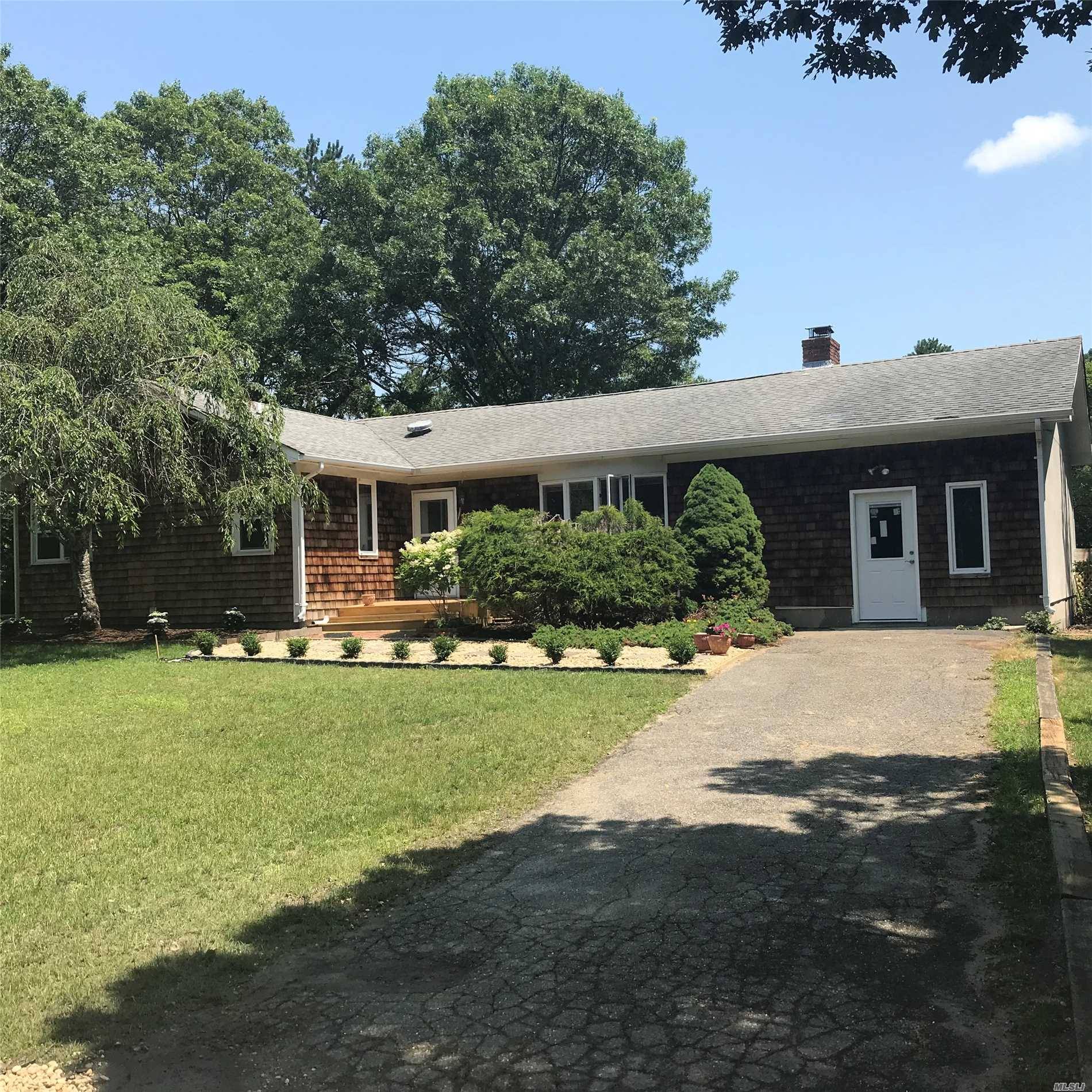 The Best Value In East Quogue Offers A Cathedral Great Room, Brick Floor To Ceiling Fireplace, New Kitchen Cabinets, Counters, Sink, And All New Stainless Steel Appliances.