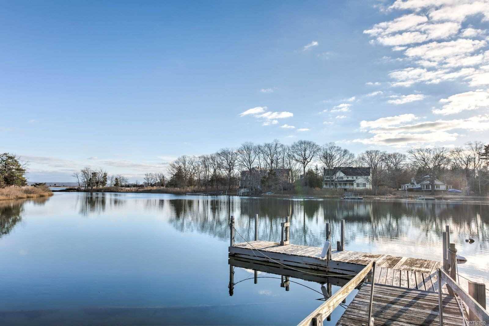 Unique waterfront property on it's own private peninsula includes 2 rare single separate creek front lots.