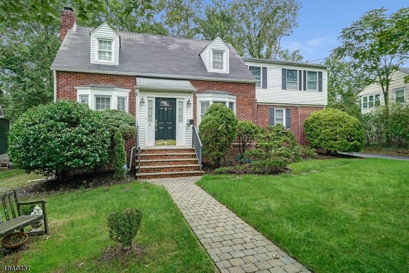 CENTER HALL COLONIAL WITH 4 SPACIOUS BEDROOMS AND 2 NEW FULL BATHS ; HARDWOOD FLOORS.