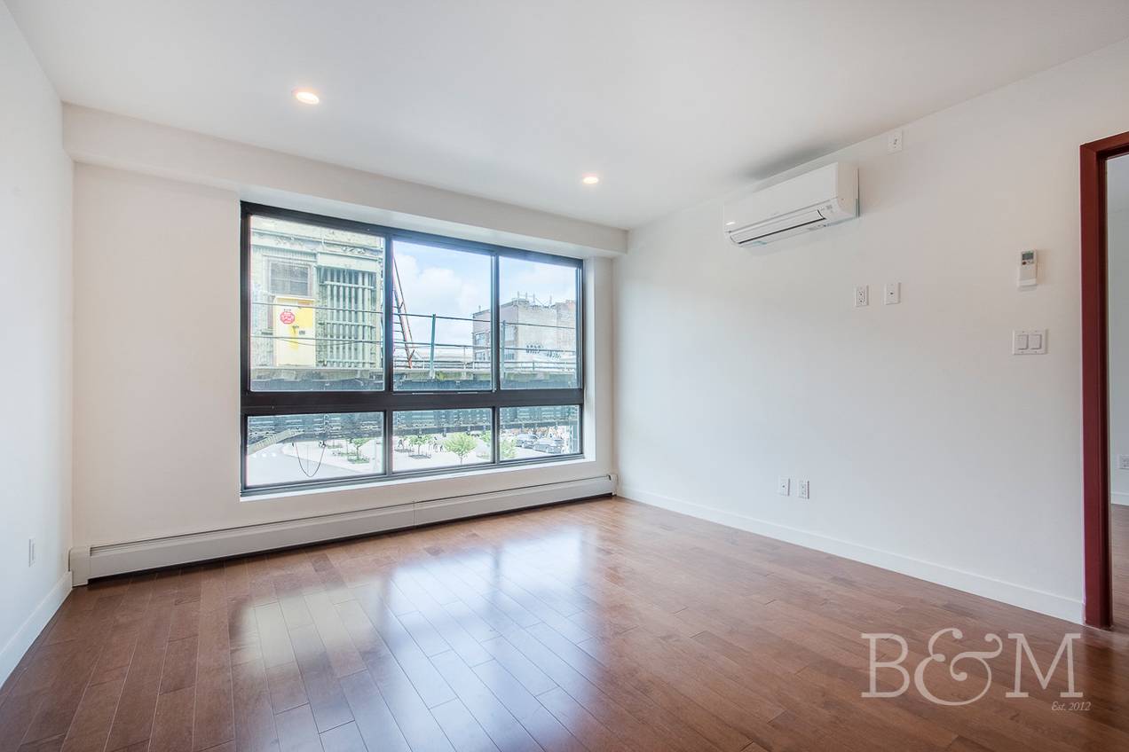 Our Thoughts This one bedroom unit features stainless steel appliances, a modern kitchen amp ; bathroom and hardwood flooring throughout.