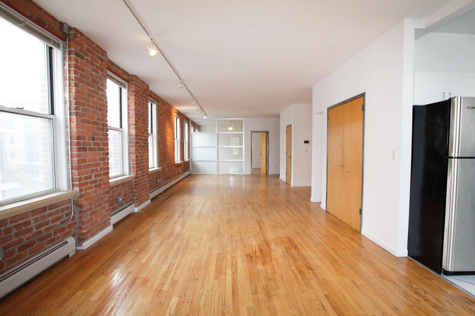 Huge authentic loft space with an abundance of large windows, exposed brick, high ceilings and plenty of open space to lay out however you want.