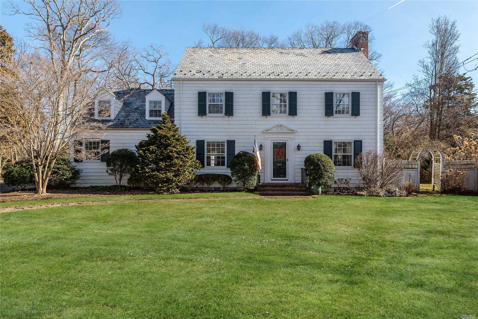 Perfectly Situated In N. Syosset, This Elegant And Open Center Hall Colonial Will Charm You The Moment You Enter The Distinguished Gated Entrance.