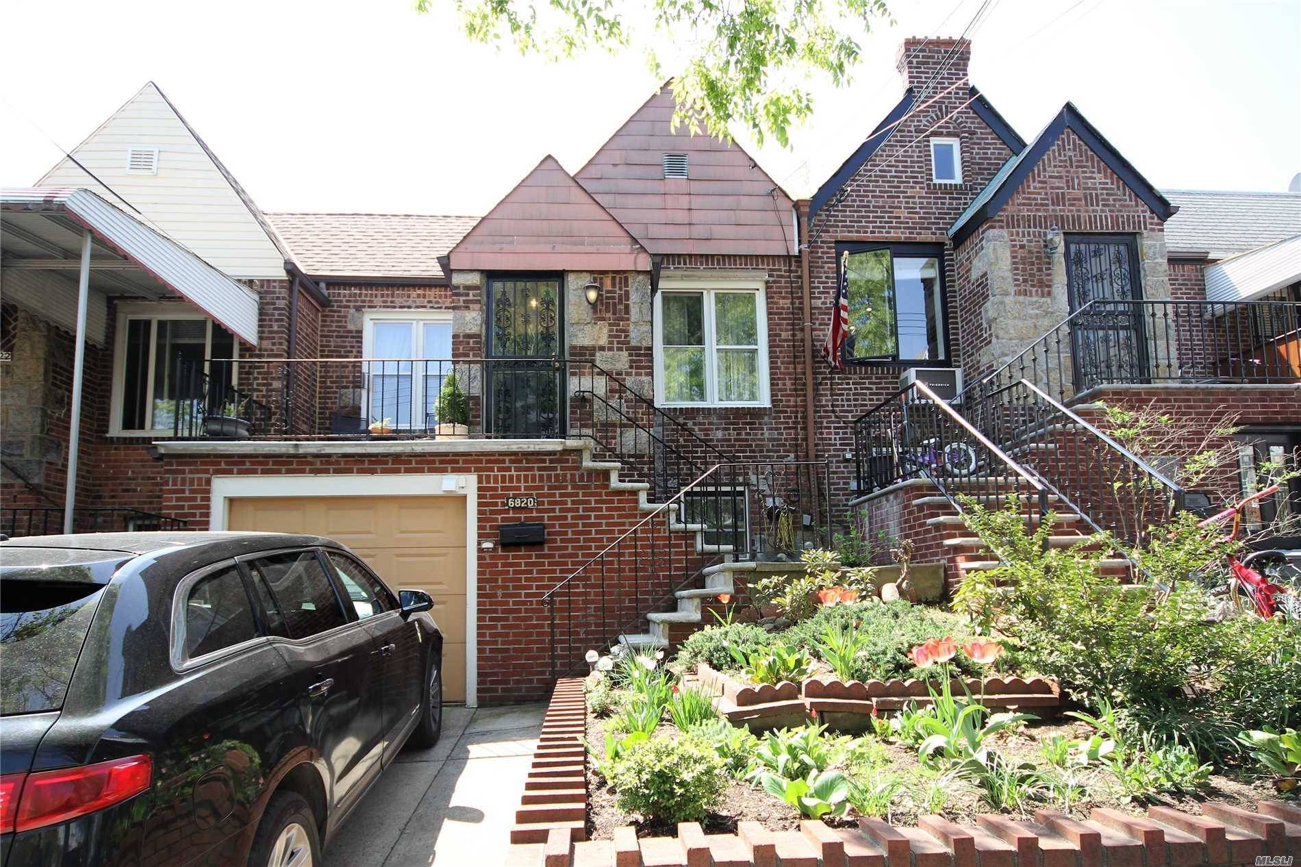 Maspeth, brick attached, 2 bedroom ranch with 1 car attached garage and private driveway.