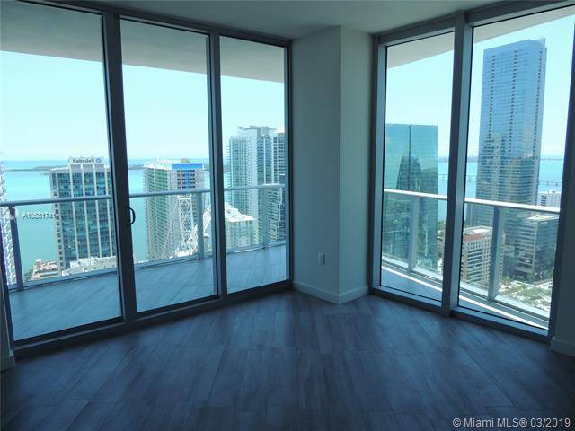 ENJOY AMAZING BAY AND CITY VIEWS FROM THIS 2/2 CORNER UNIT WITH WRAP AROUND BALCONY