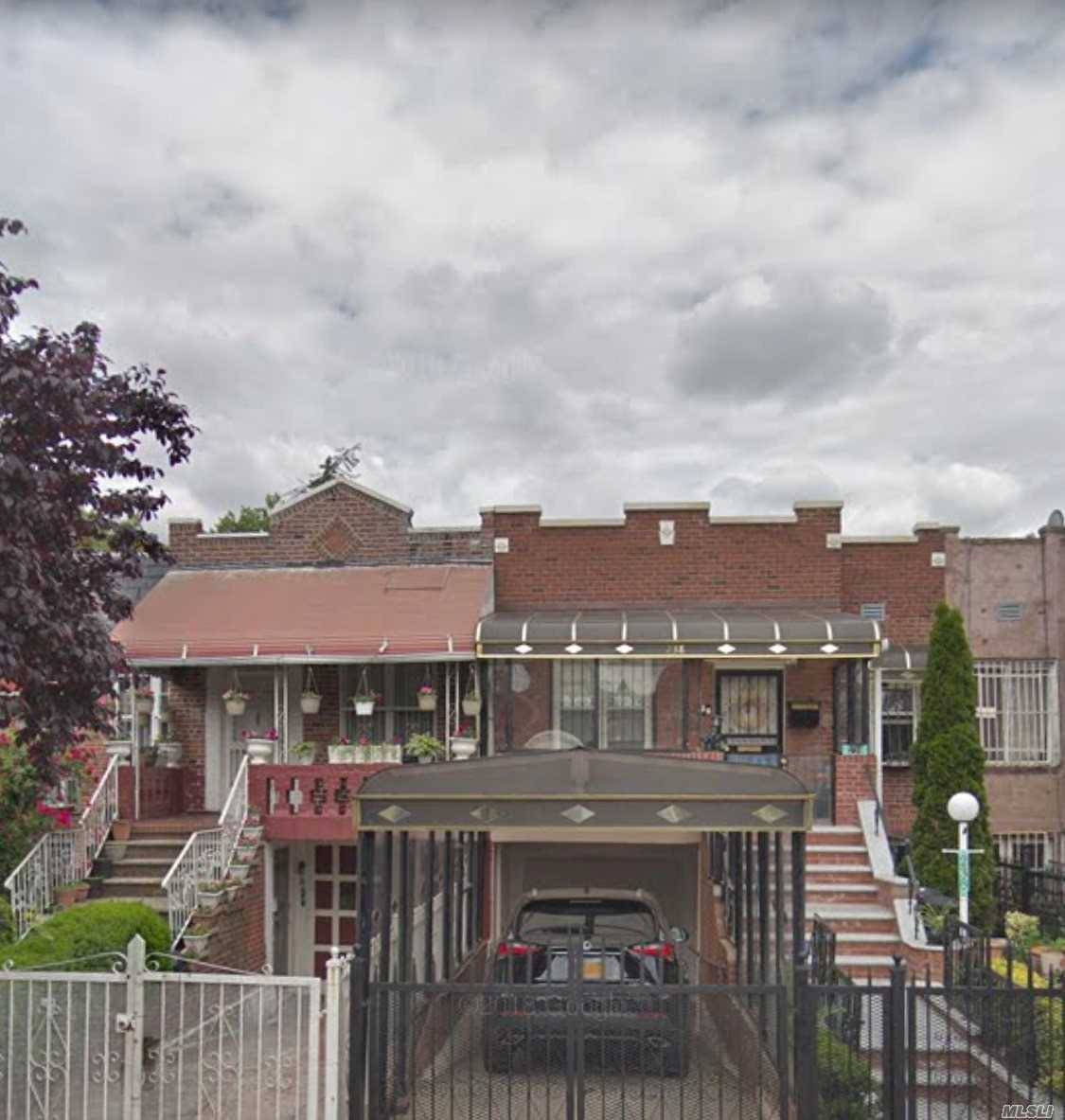 Two Family Attached Brick Townhouse Located In The East Flatbush Section Of Brooklyn.