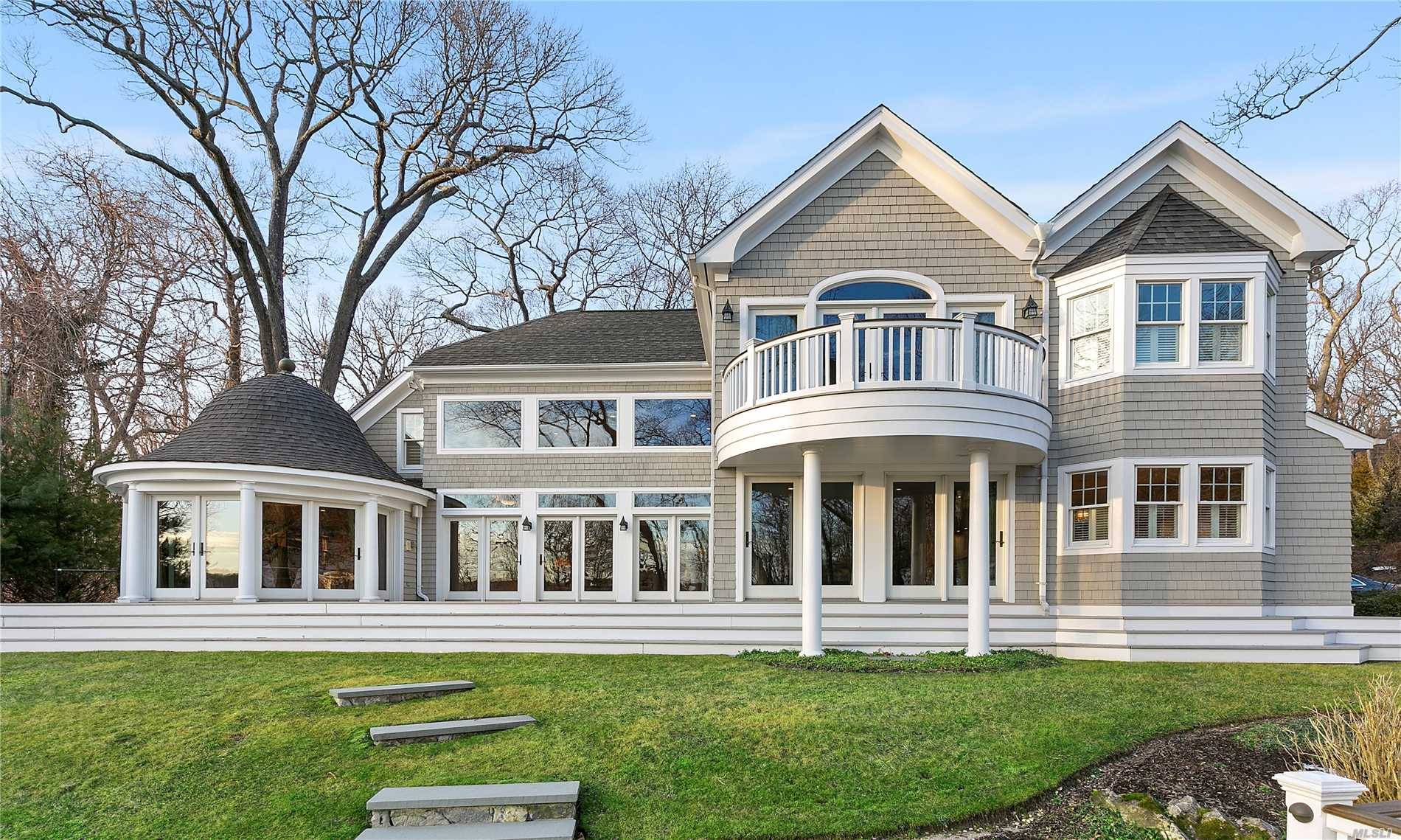 Sitting Steadfastly In One Of The North Shore's Most Exclusive Neighborhoods, Is A Sophisticated, Sun Drenched, Waterview Nantucket Style Estate Surrounded By An Award Winning Pool Retreat And Landscape Design.
