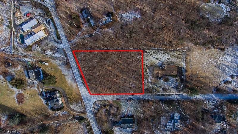 Totally level 1. 5 acre building lot in a neighborhood of multi million dollar homes.