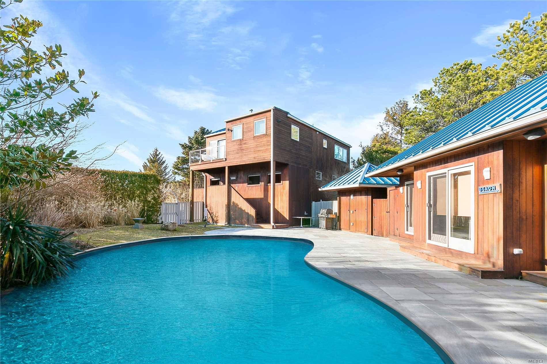You Can Have It All In This Immaculate Modern Compound In The Amagansett Dunes With A Heated Pool, Just One Block From The Ocean.