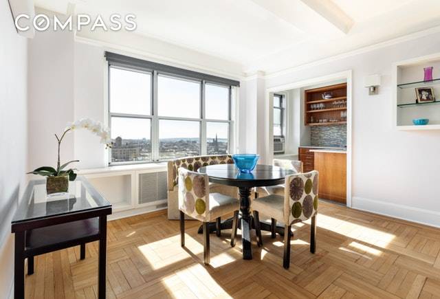 Sitting high above Grand Army Plaza with spectacular views east and south, from sunrise to sunset this top floor corner apartment is filled with wonderful light.