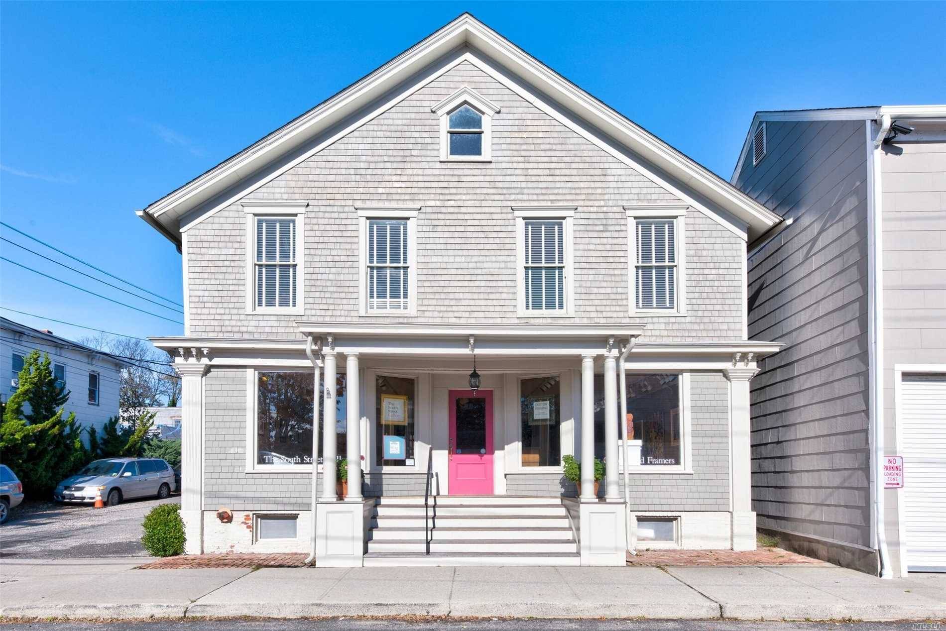 Commercial building in the heart of Greenport Village in mint condition offering multiple retail spaces 2nd floor apartment.