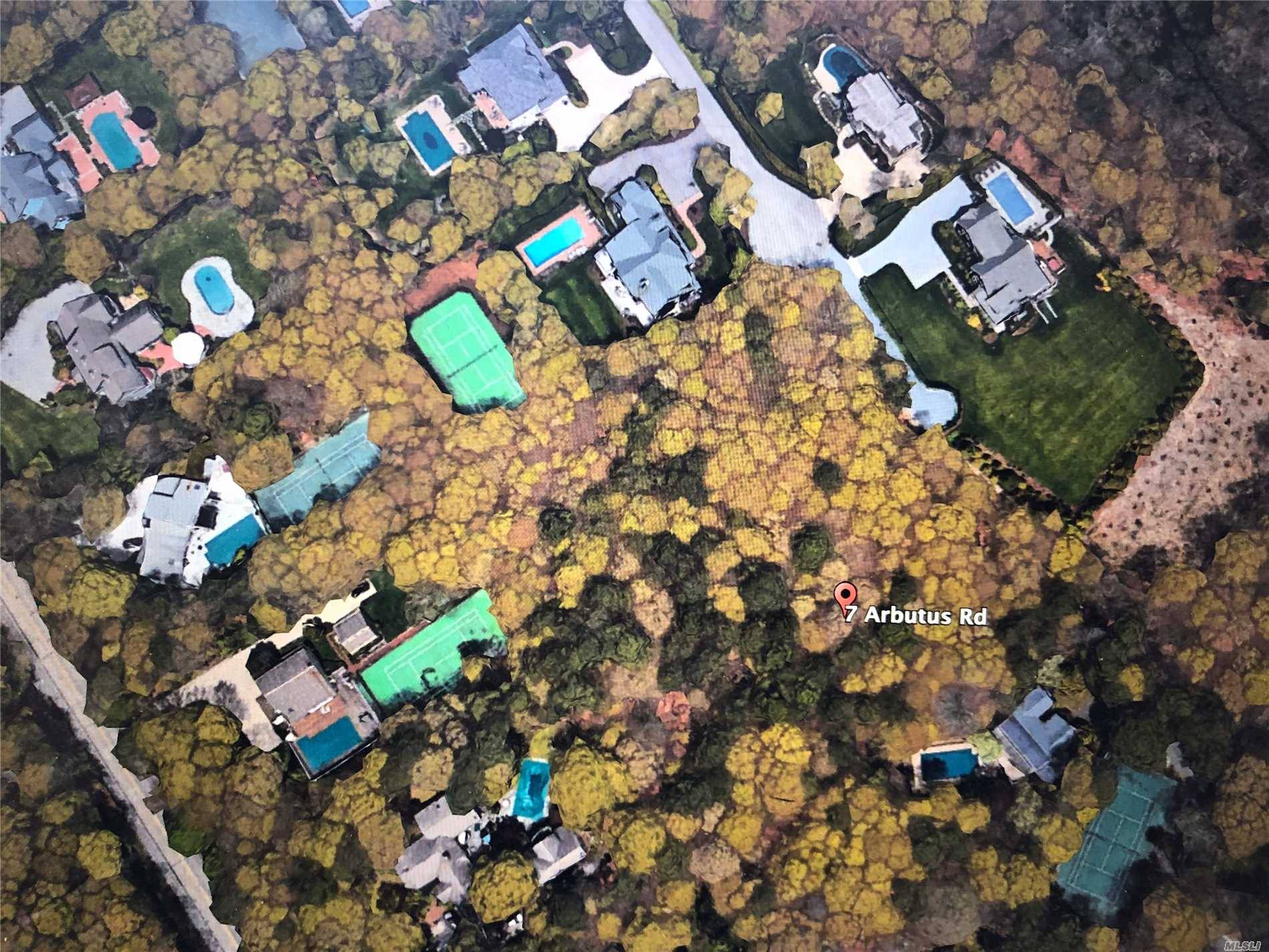 Nicely wooded 1 acre plus building lot is now available in the Village of Quogue.