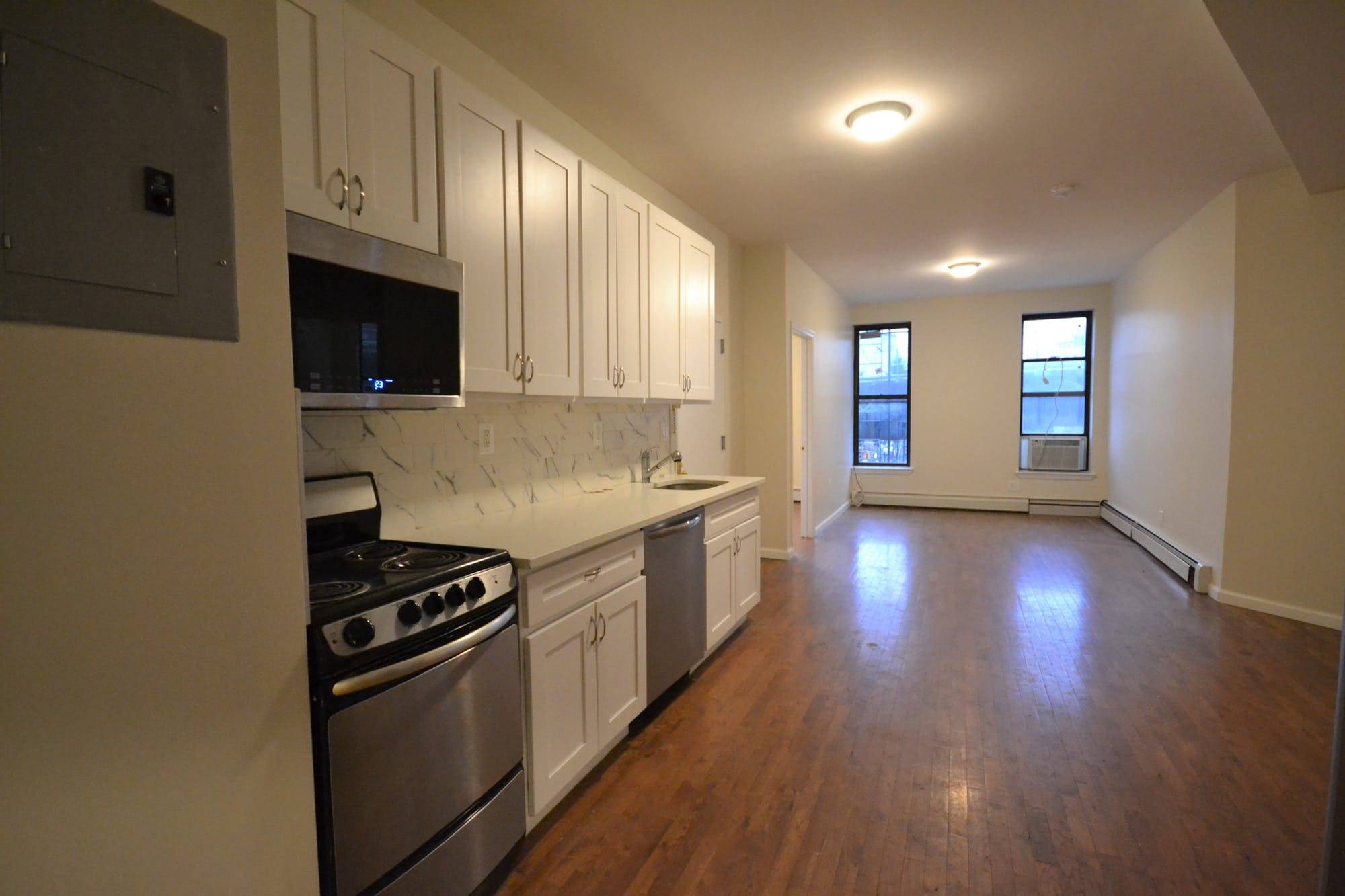 This incredible 4 bedroom Bed Stuy home offers stainless steel kitchen appliances, including a dishwasher and microwave.