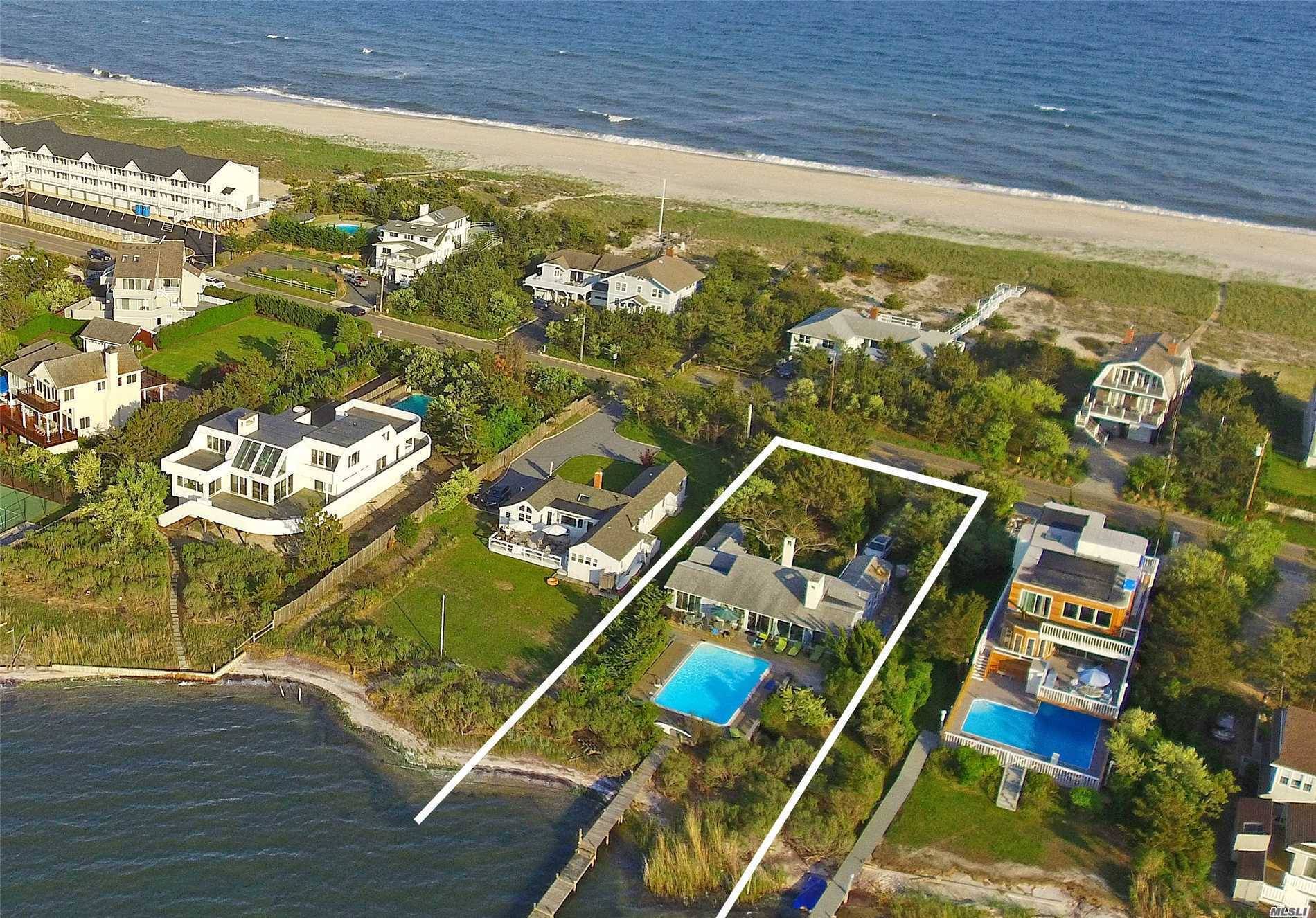 This very private bayfront home offers a living room, dining area, updated kitchen, laundry room, two master bedrooms with baths, 2 additional guest rooms and 2 additional full baths, CAC, ...