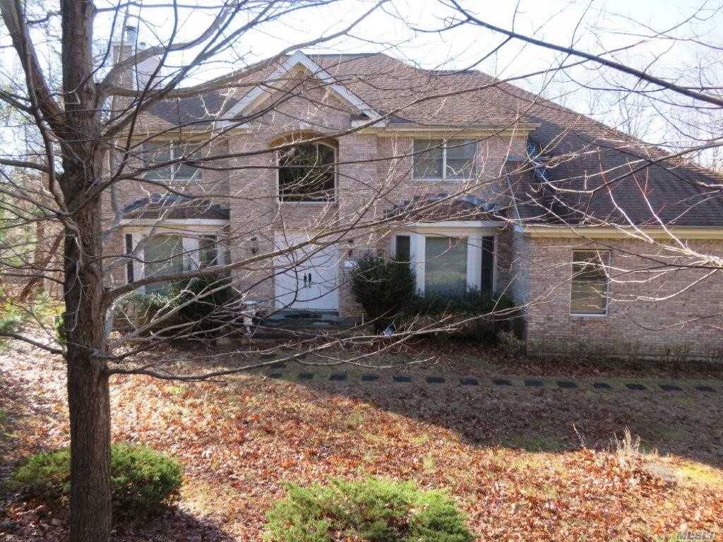 This Is A Bank Owned Brick Front Colonial Located on One Acre.