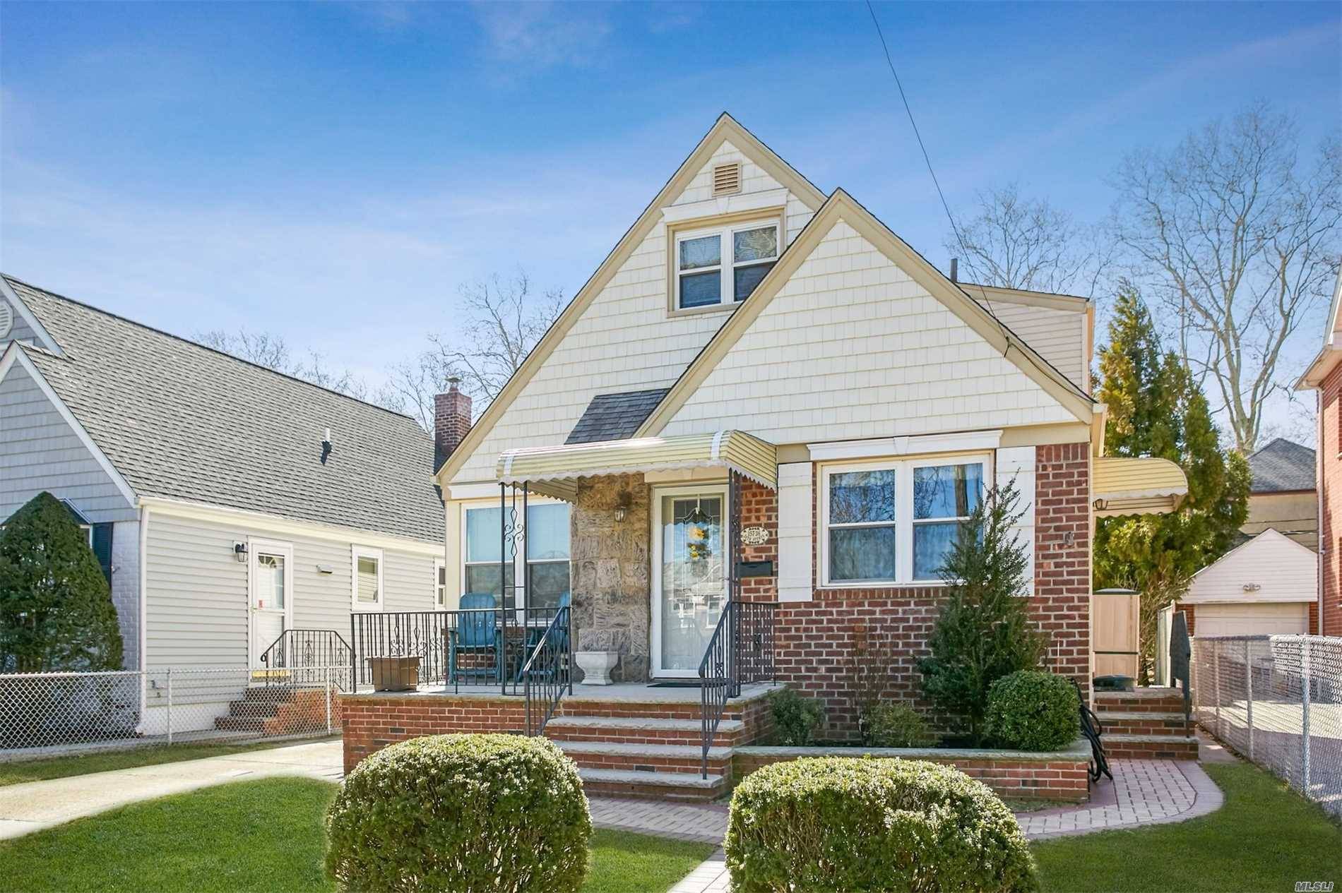 Bright, clean 4 BR, 2 full bath Cape in desirable area of Flushing North.